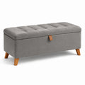 Coffre de rangement en tissu gris avec pieds en bois