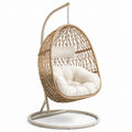 Fauteuil suspendu en rotin synthétique beige avec coussin crème et support en acier